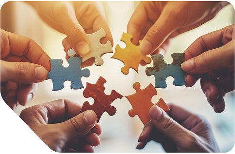 Six hands each holding a piece of a puzzle